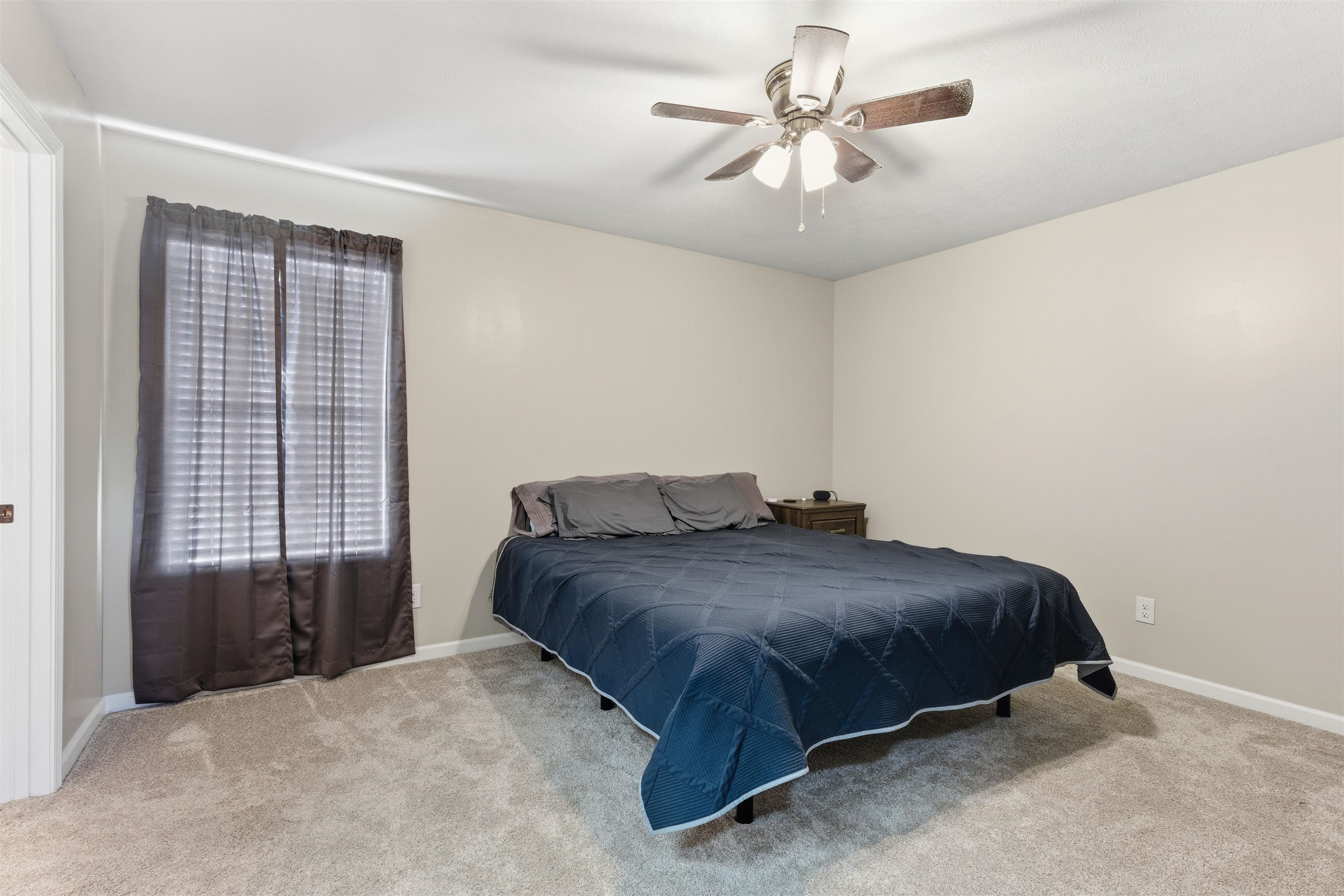448 Stevens Road Bolivar, TN 38008 - Photo 20 of 25 Bedroom featuring light colored carpet and a ceiling fan