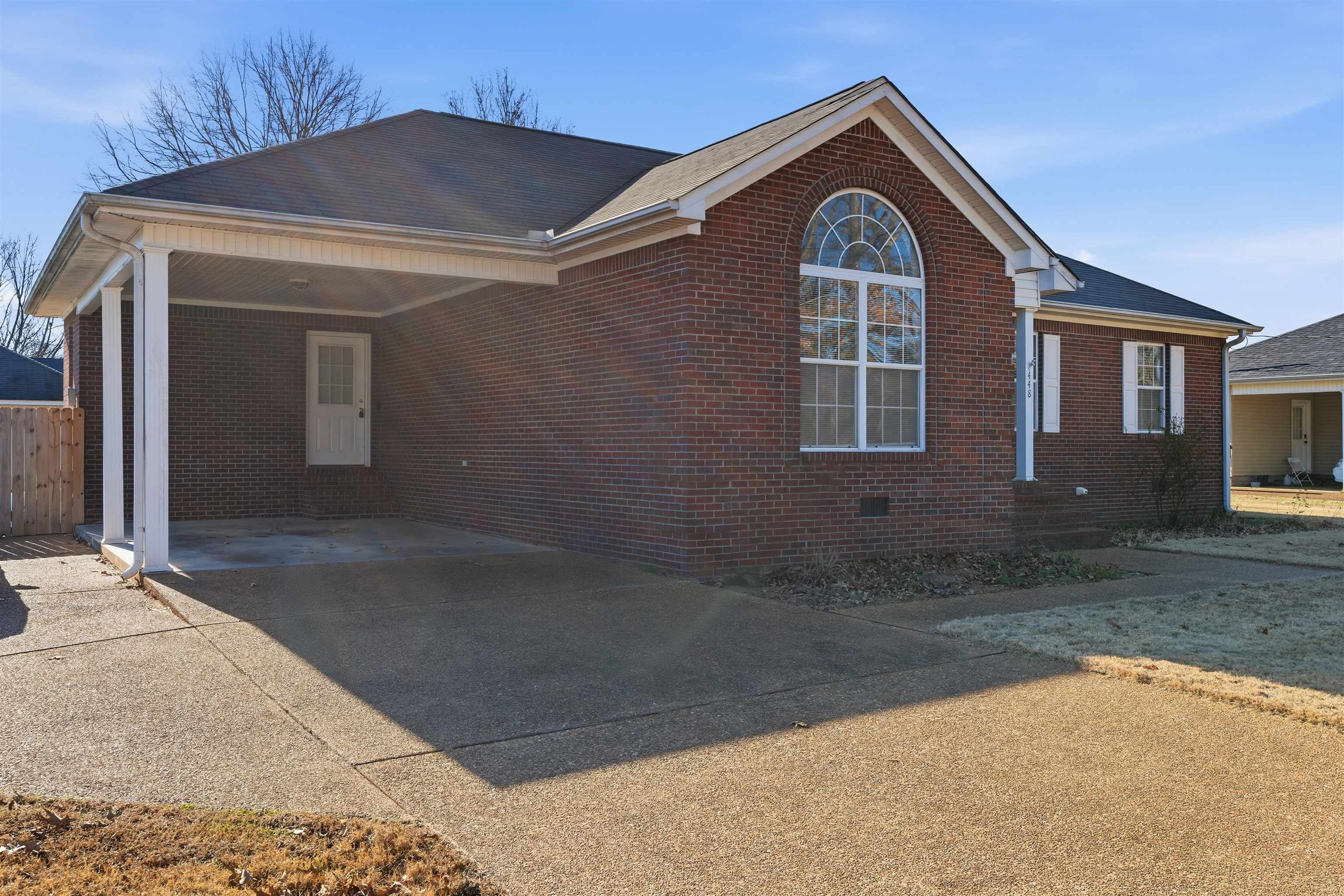 448 Stevens Road Bolivar, TN 38008 - Photo 2 of 25 View of front of property with driveway, brick siding, and a carport