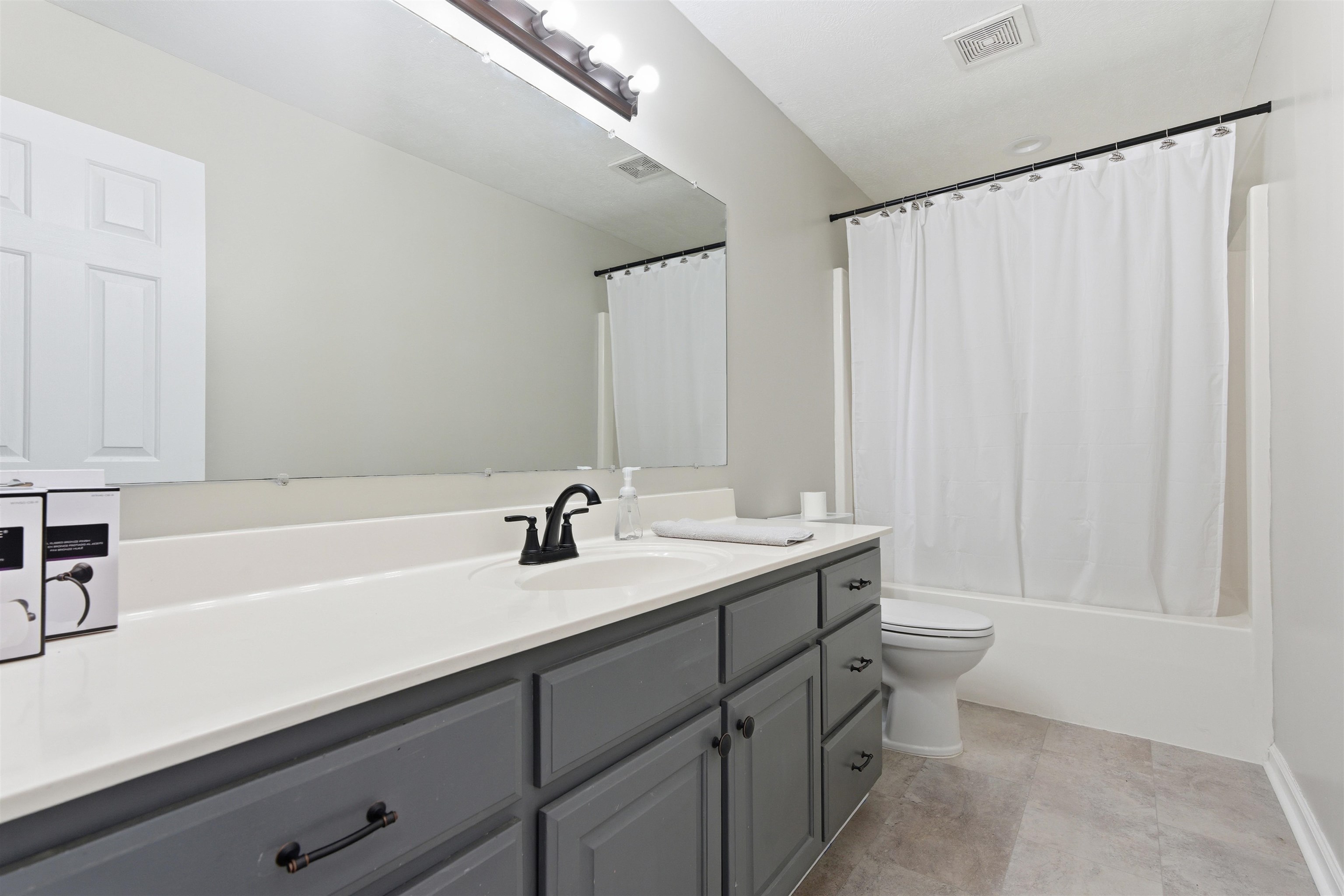 448 Stevens Road Bolivar, TN 38008 - Photo 22 of 25 Full bathroom with vanity and shower / bath combo with shower curtain