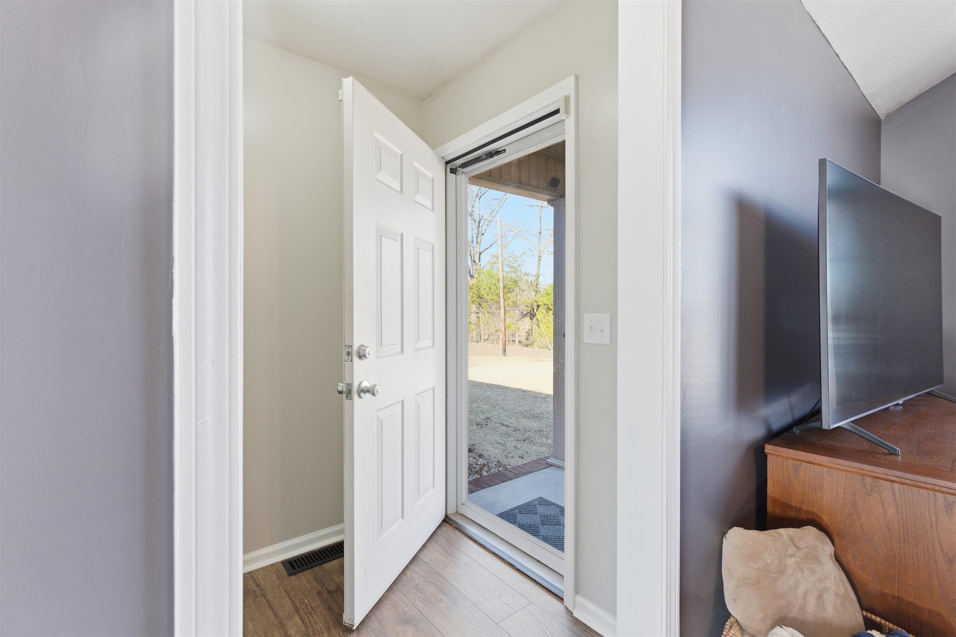 448 Stevens Road Bolivar, TN 38008 - Photo 7 of 25 Entryway with wood finished floors and baseboards