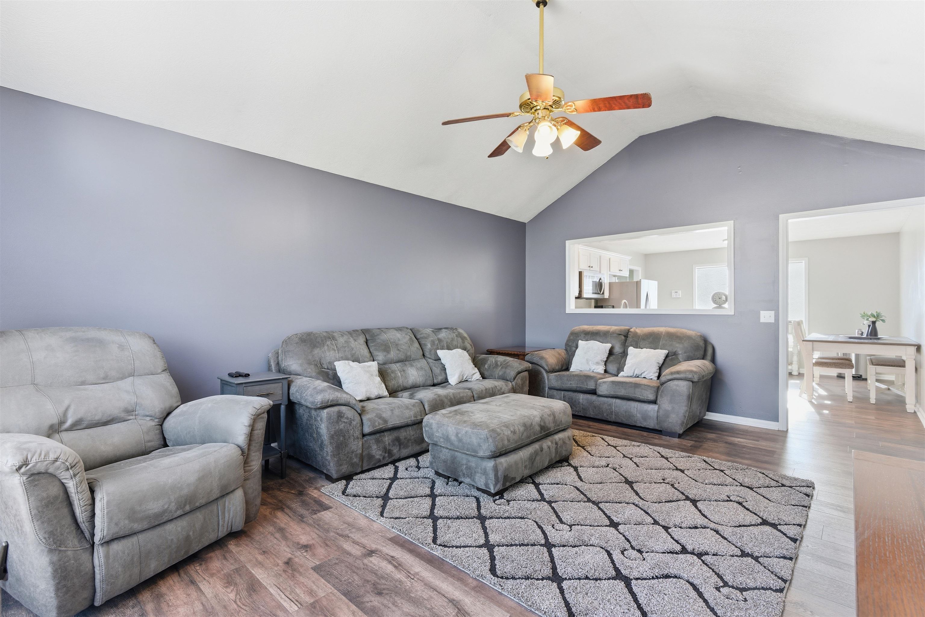 448 Stevens Road Bolivar, TN 38008 - Photo 9 of 25 Living room featuring ceiling fan and wood finished floors