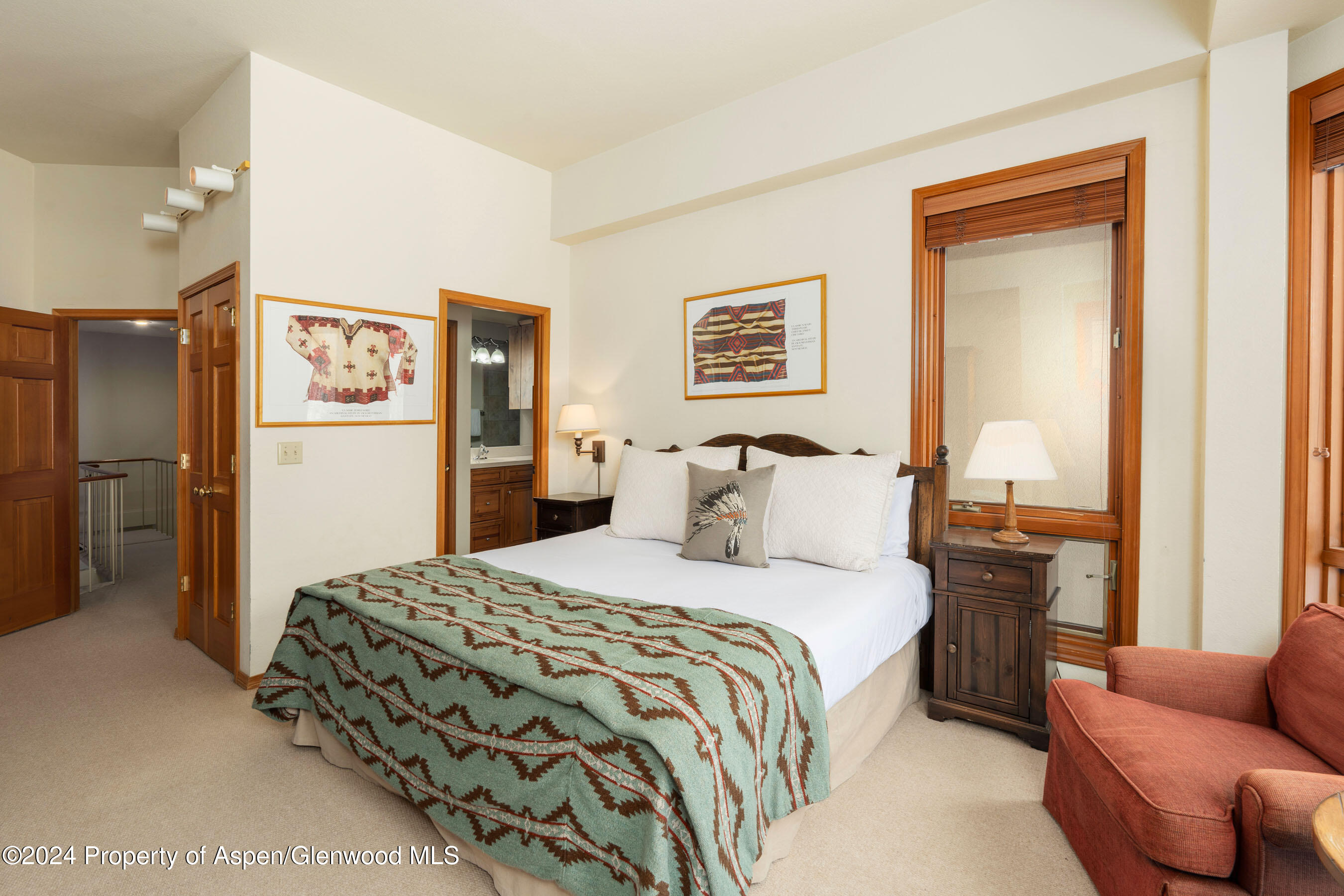 476 Wood Road, Unit 41 Snowmass Village, CO 81615 - Photo 16 of 29 a bedroom with a bed and a couch