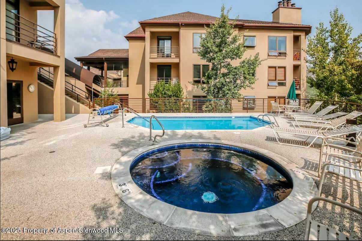 476 Wood Road, Unit 41 Snowmass Village, CO 81615 - Photo 18 of 29 a view of outdoor space yard and swimming pool