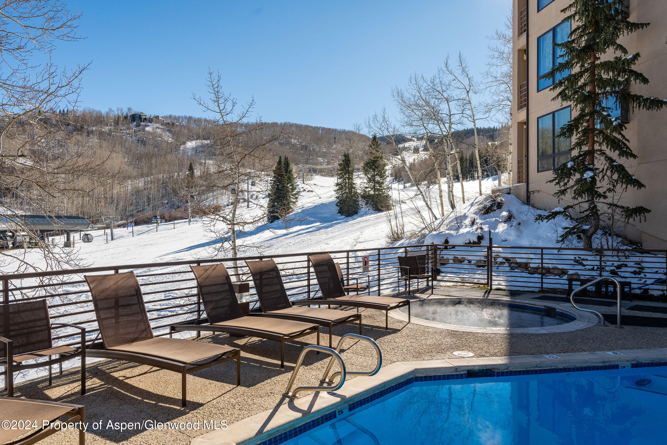 476 Wood Road, Unit 41 Snowmass Village, CO 81615 - Photo 20 of 29 a view of a patio with chairs and a table