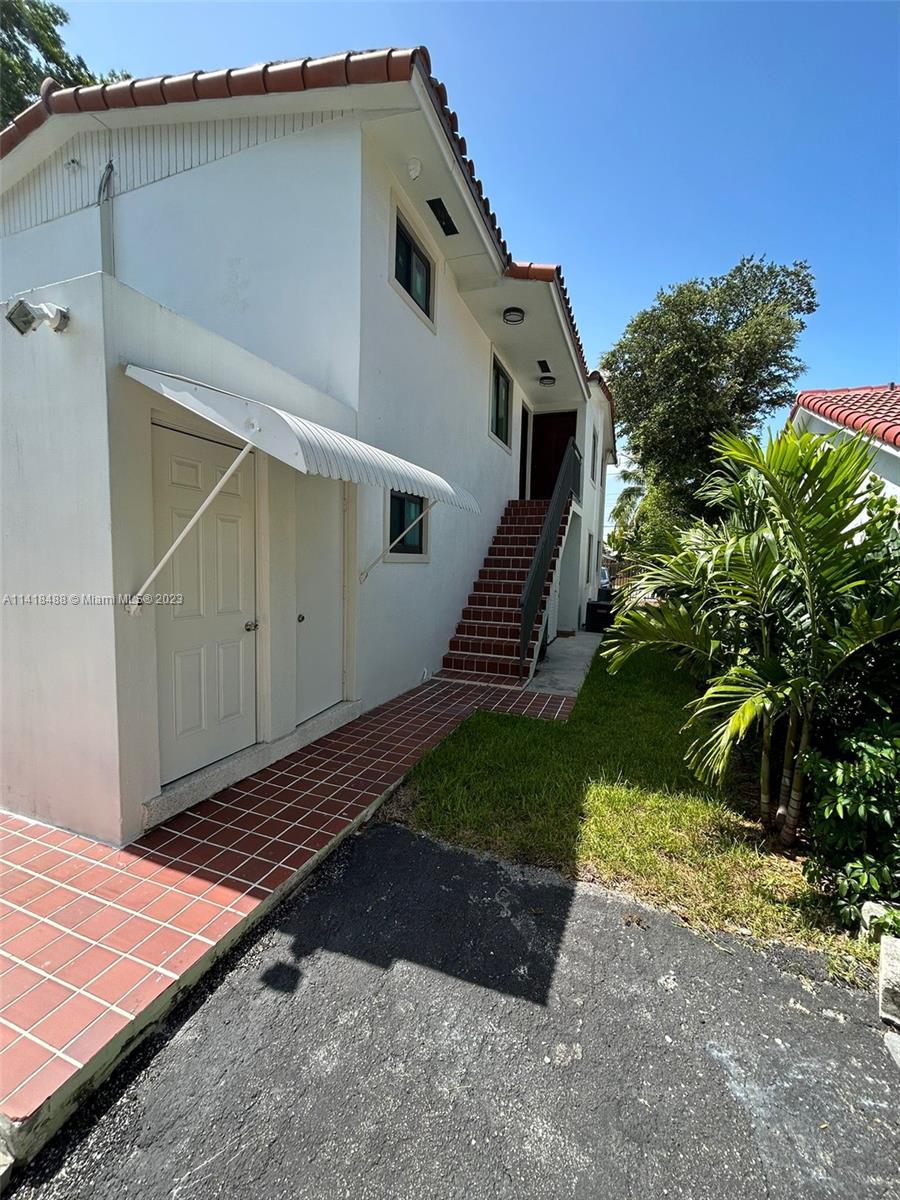 46 Northwest 35th Street Miami, FL 33127 - Photo 14 of 17 a front view of a house with garden