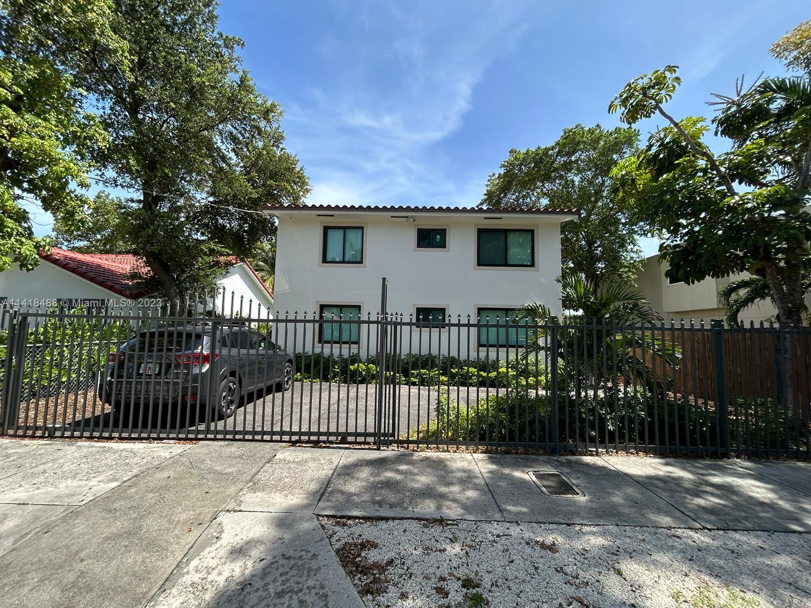 46 Northwest 35th Street Miami, FL 33127 - Photo 2 of 17 a view of a house with a street view and a fence