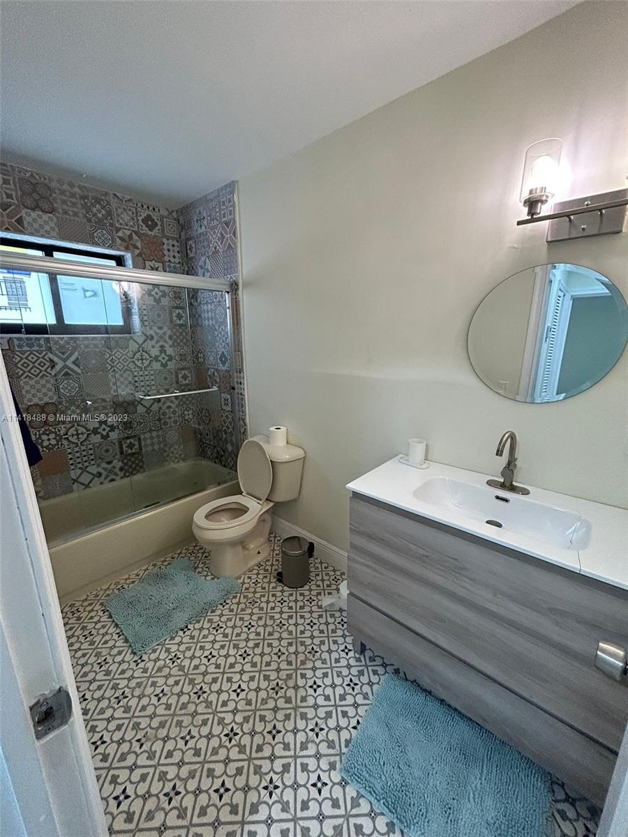 46 Northwest 35th Street Miami, FL 33127 - Photo 7 of 17 a bathroom with a sink a toilet and shower