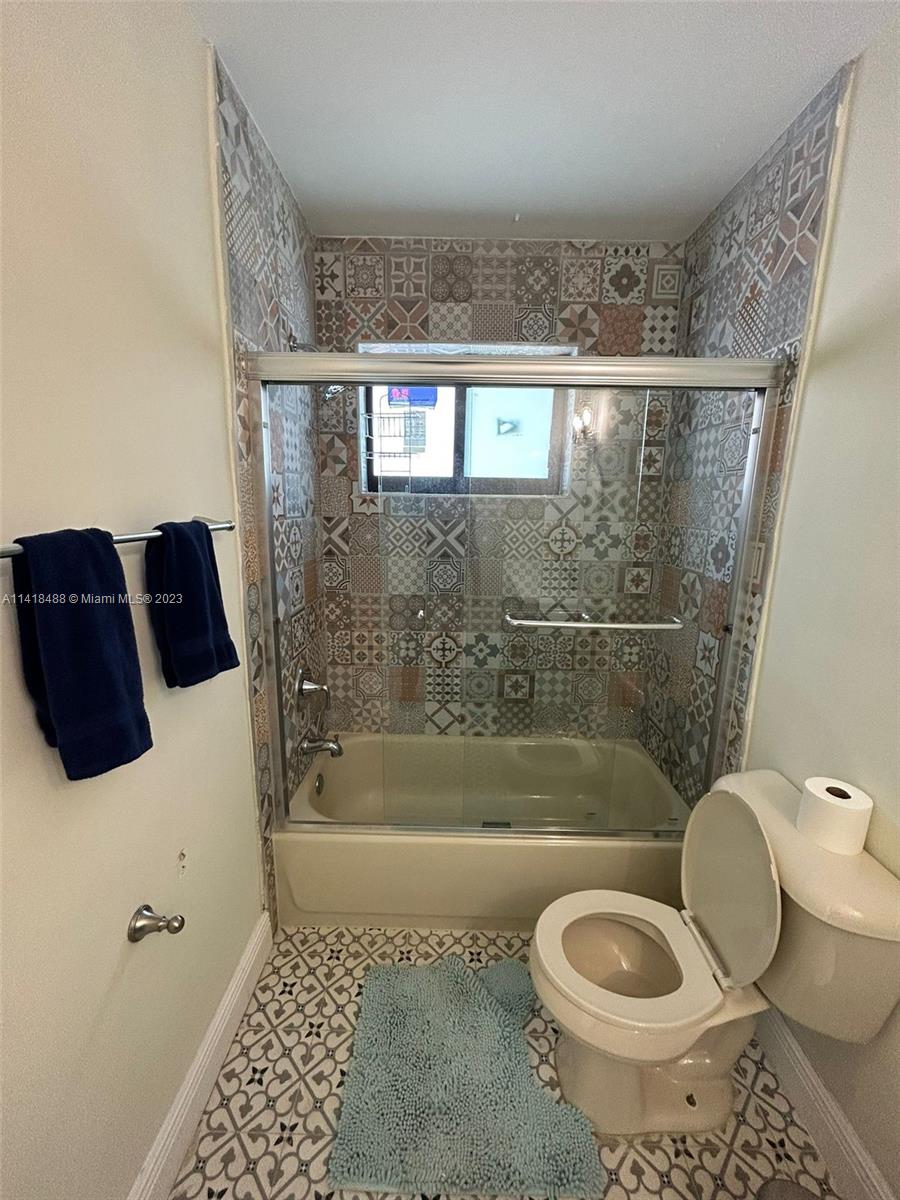 46 Northwest 35th Street Miami, FL 33127 - Photo 8 of 17 a bathroom with a bathtub and a shower