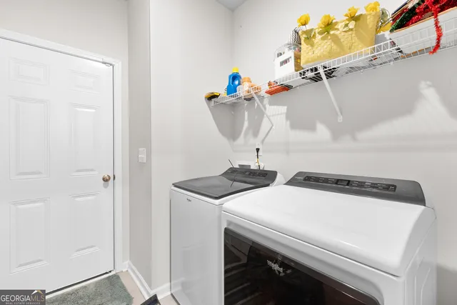 a utility room with dryer and washer