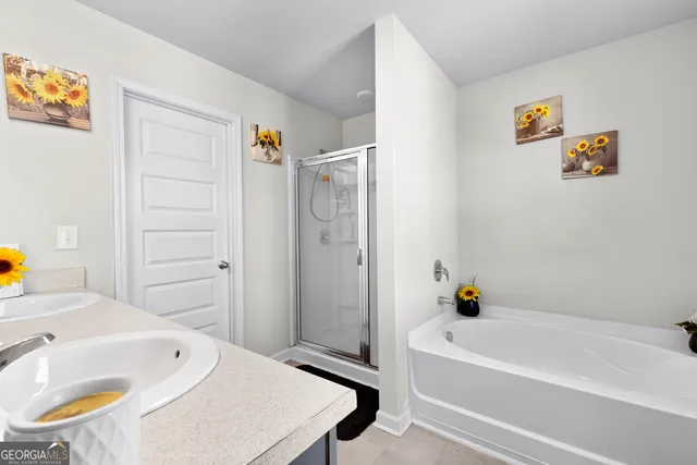 a bathroom with a bathtub and a sink