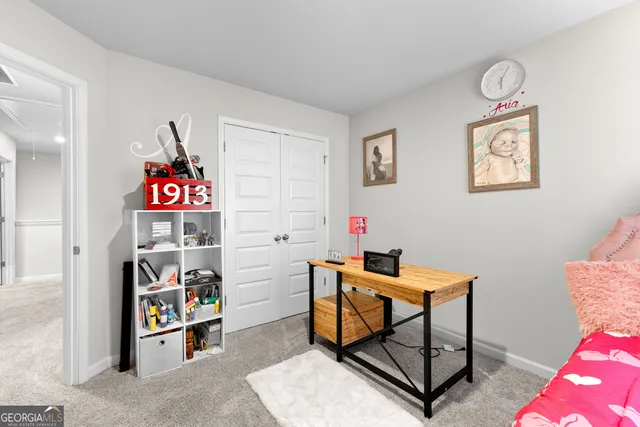 a room with furniture a rug and a window