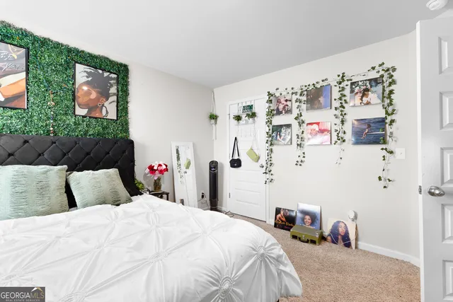 a bedroom with a bed and a couch