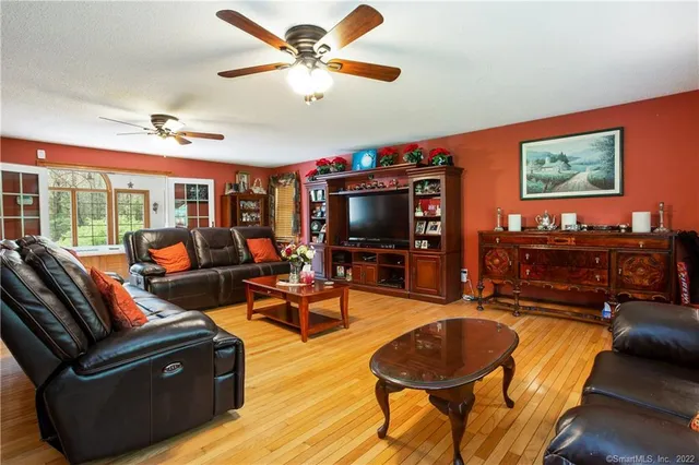 a living room with furniture and a flat screen tv