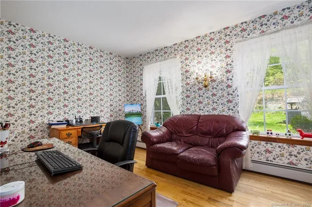 a living room with furniture and a window