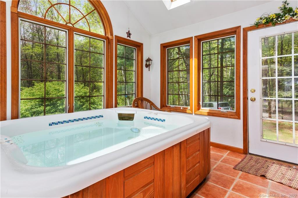 37 Hidden Hill Road New Hartford, CT 06057 - Photo 15 of 36 a bath tub sitting in front of a window