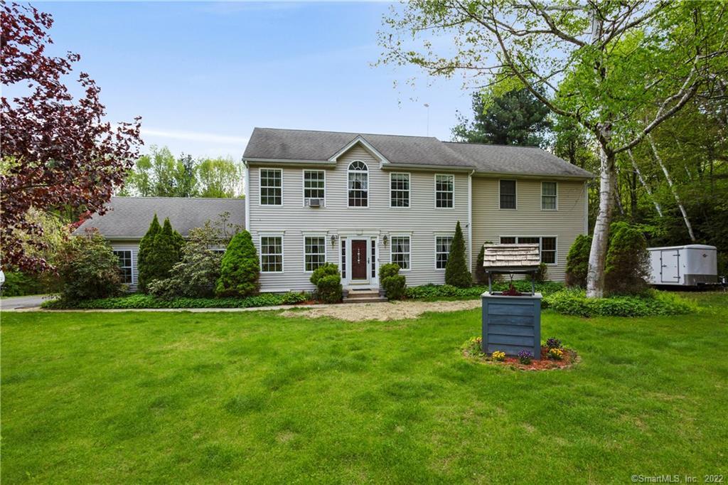37 Hidden Hill Road New Hartford, CT 06057 - Photo 2 of 36 a front view of a house with a garden and porch