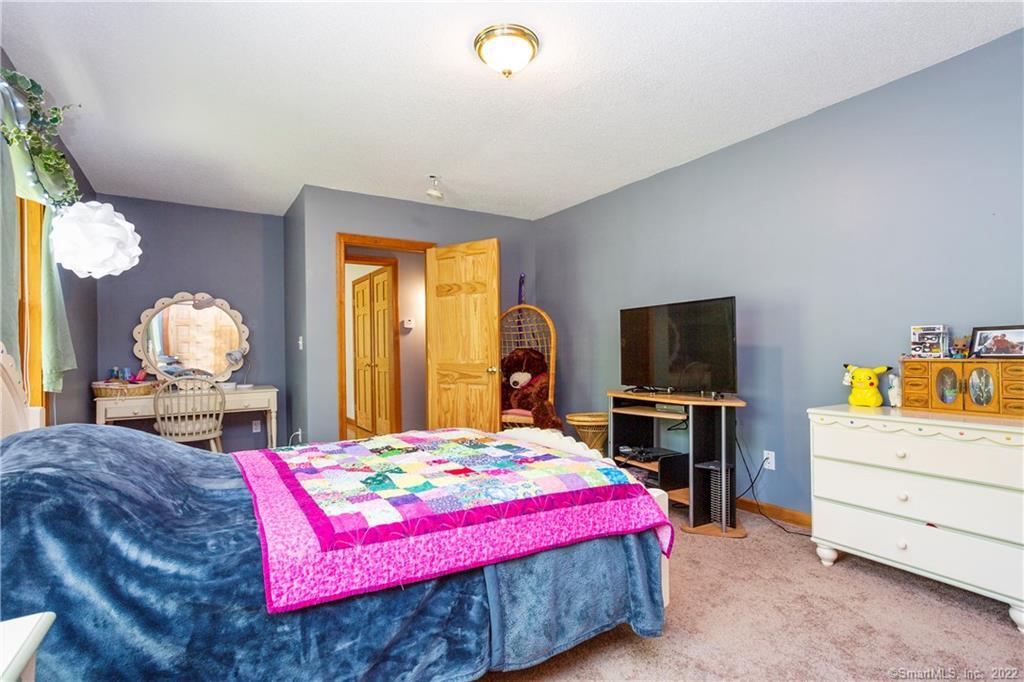 37 Hidden Hill Road New Hartford, CT 06057 - Photo 23 of 36 a bedroom with a bed and a dresser