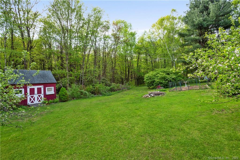 37 Hidden Hill Road New Hartford, CT 06057 - Photo 31 of 36 a view of a bench in a garden