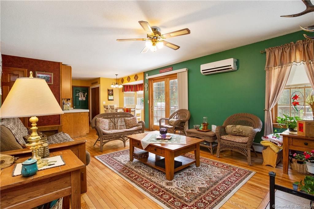 37 Hidden Hill Road New Hartford, CT 06057 - Photo 5 of 36 a living room with furniture fireplace and a large window