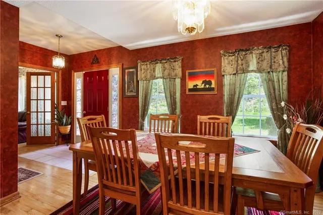 a view of a dining room with furniture window and outside view