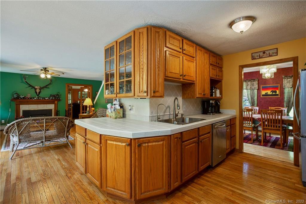 37 Hidden Hill Road New Hartford, CT 06057 - Photo 10 of 36 a kitchen with stainless steel appliances granite countertop a sink and wooden cabinets