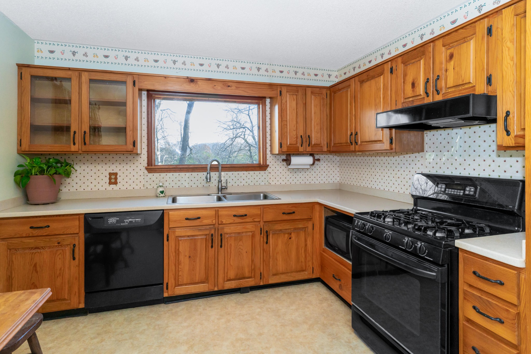 11405 Highway 58 Georgetown, TN 37336 - Photo 42 of 70 a kitchen with stainless steel appliances a sink stove and cabinets