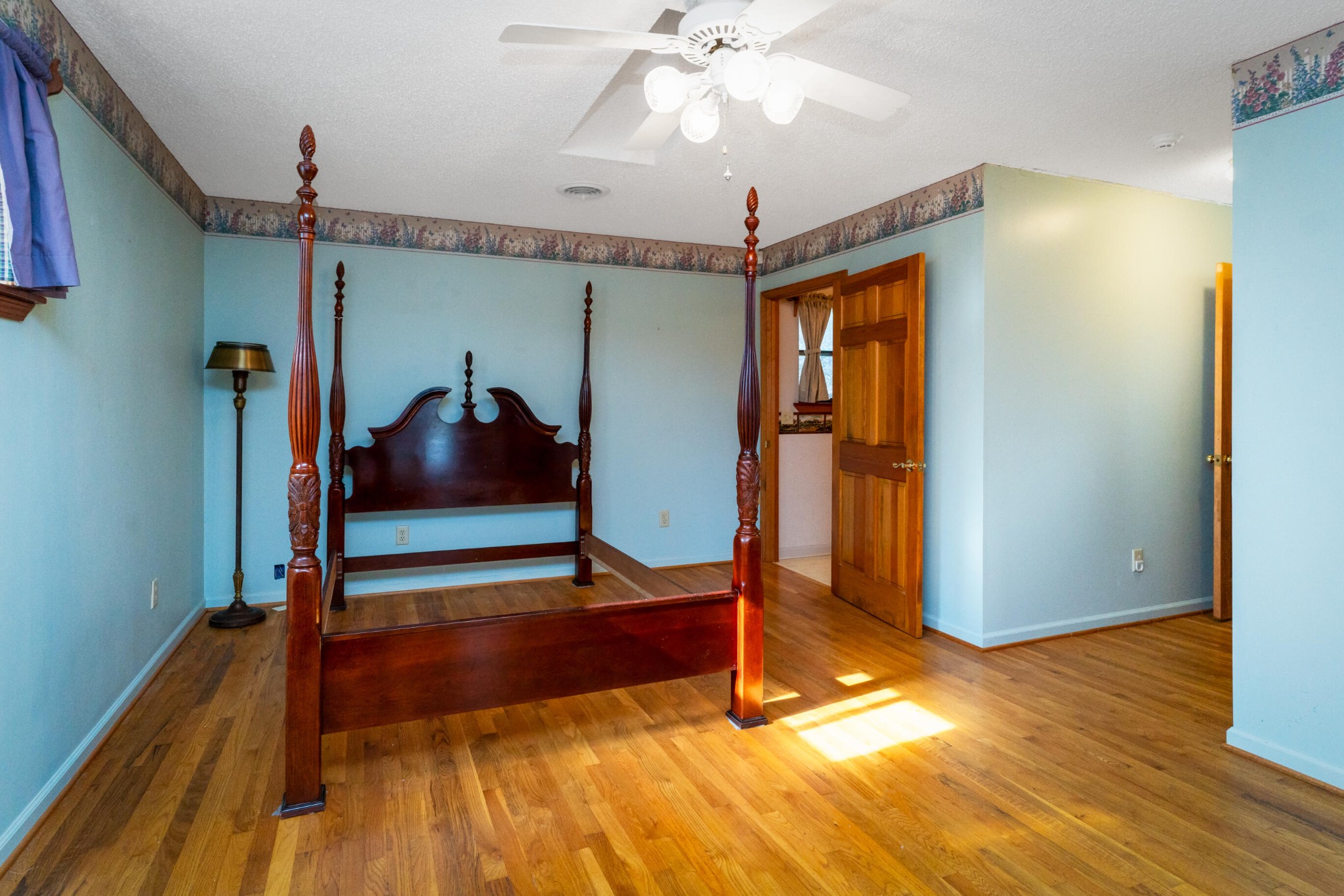 11405 Highway 58 Georgetown, TN 37336 - Photo 48 of 70 a view of a room with wooden floor and ceiling fan