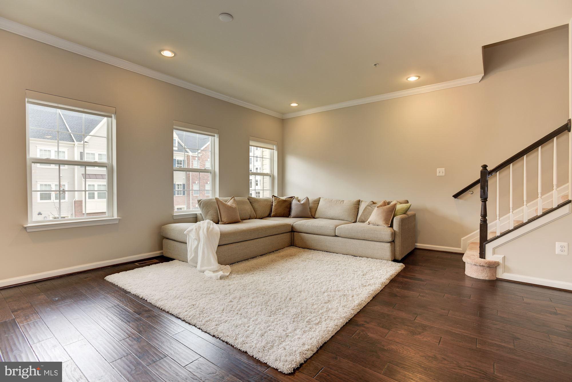 7565 Crowley Street Hanover, MD 21076 - Photo 12 of 40 Living Room | Hardwood | Automatic Shades.