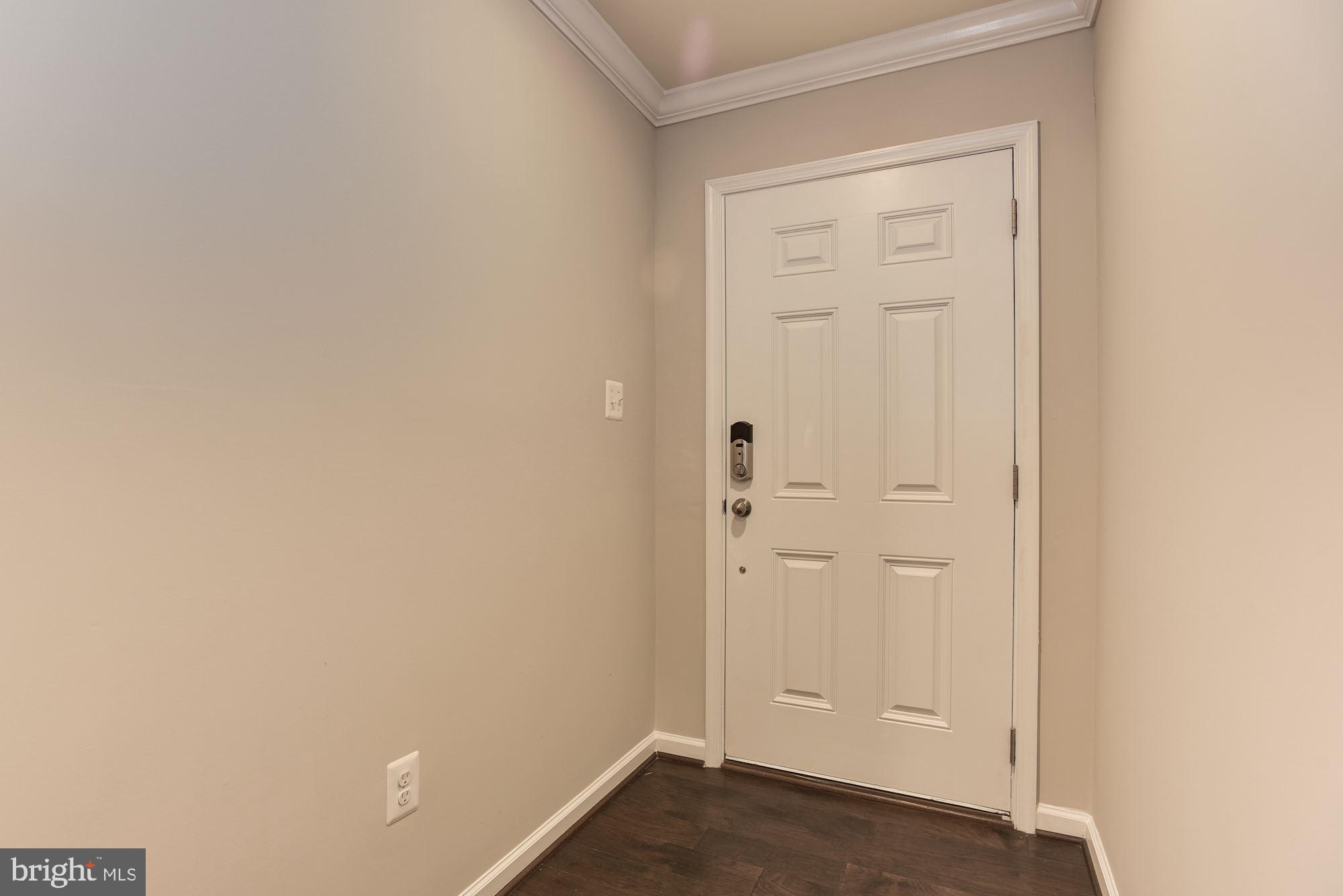 7565 Crowley Street Hanover, MD 21076 - Photo 24 of 40 Foyer | Crown Moulding | Smart Lock.