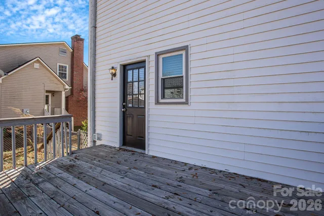 a view of backyard with outdoor seating