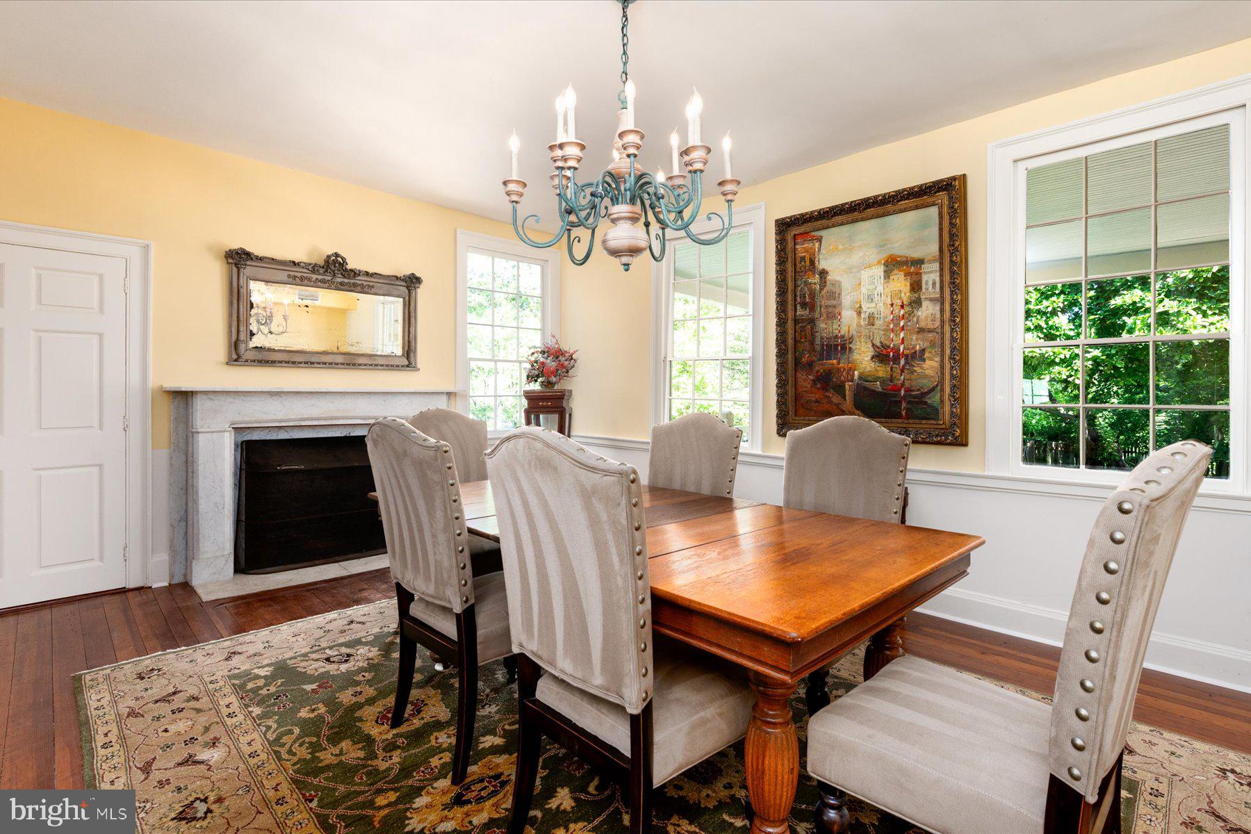 5503 Brooks Woods Road Lothian, MD 20711 - Photo 16 of 99 a view of a dining room with furniture window and wooden floor