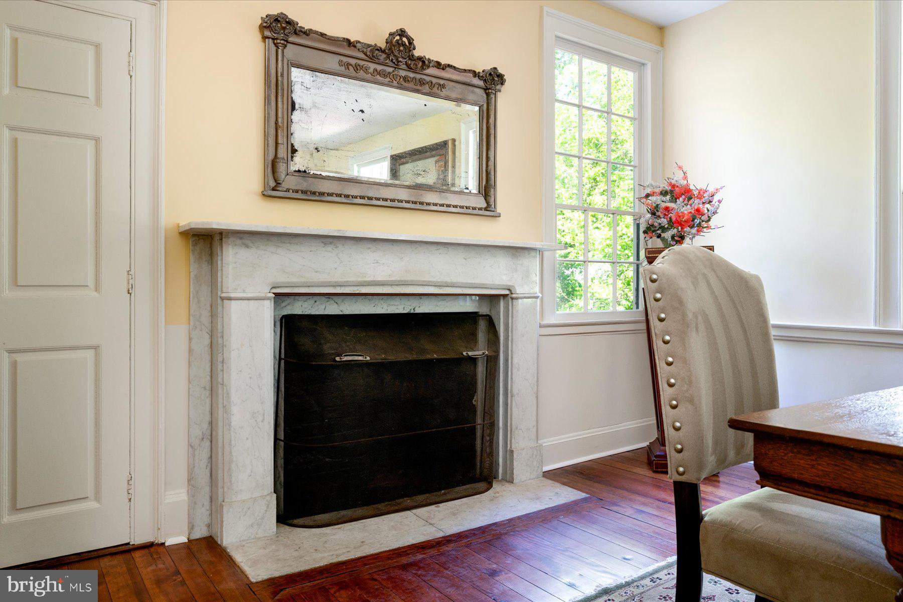 5503 Brooks Woods Road Lothian, MD 20711 - Photo 18 of 99 a living room with furniture and a fireplace