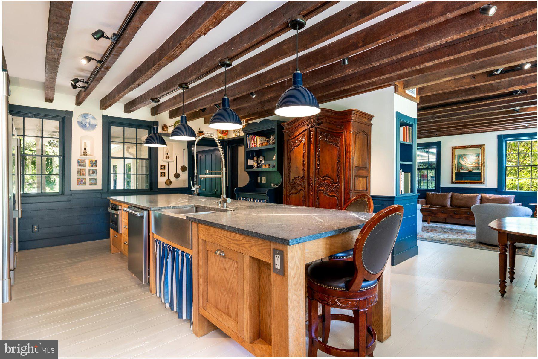 5503 Brooks Woods Road Lothian, MD 20711 - Photo 23 of 99 a dining hall with stainless steel appliances granite countertop a stove a sink and a refrigerator