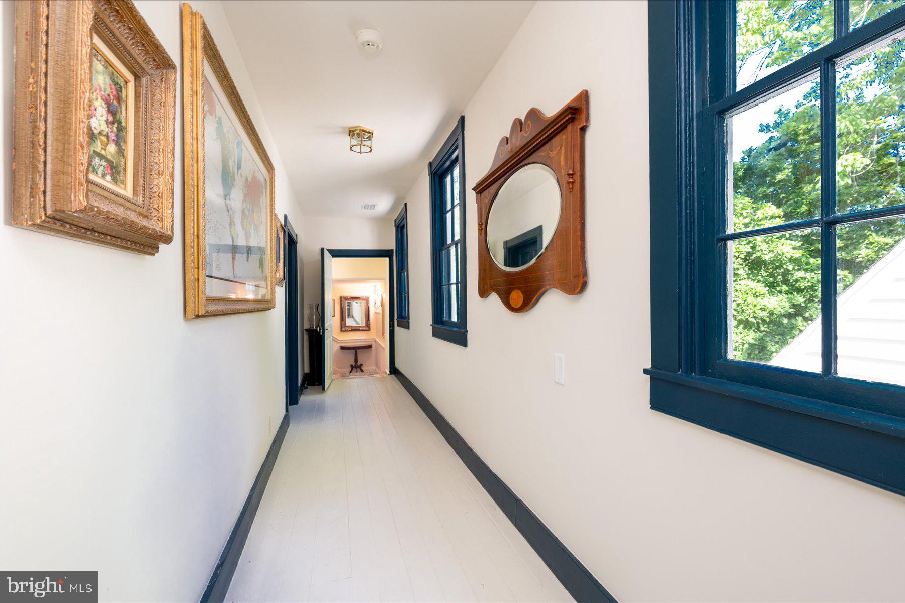 5503 Brooks Woods Road Lothian, MD 20711 - Photo 29 of 99 a view of a hallway with wooden floor and windows