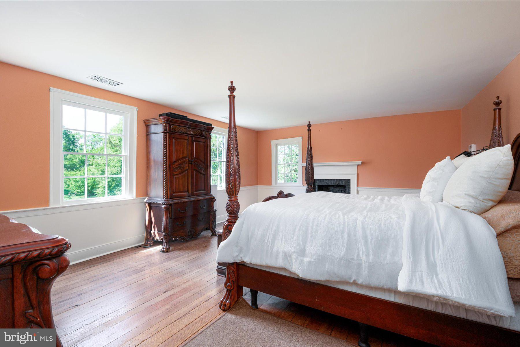 5503 Brooks Woods Road Lothian, MD 20711 - Photo 30 of 99 a bedroom with a bed and wooden floor