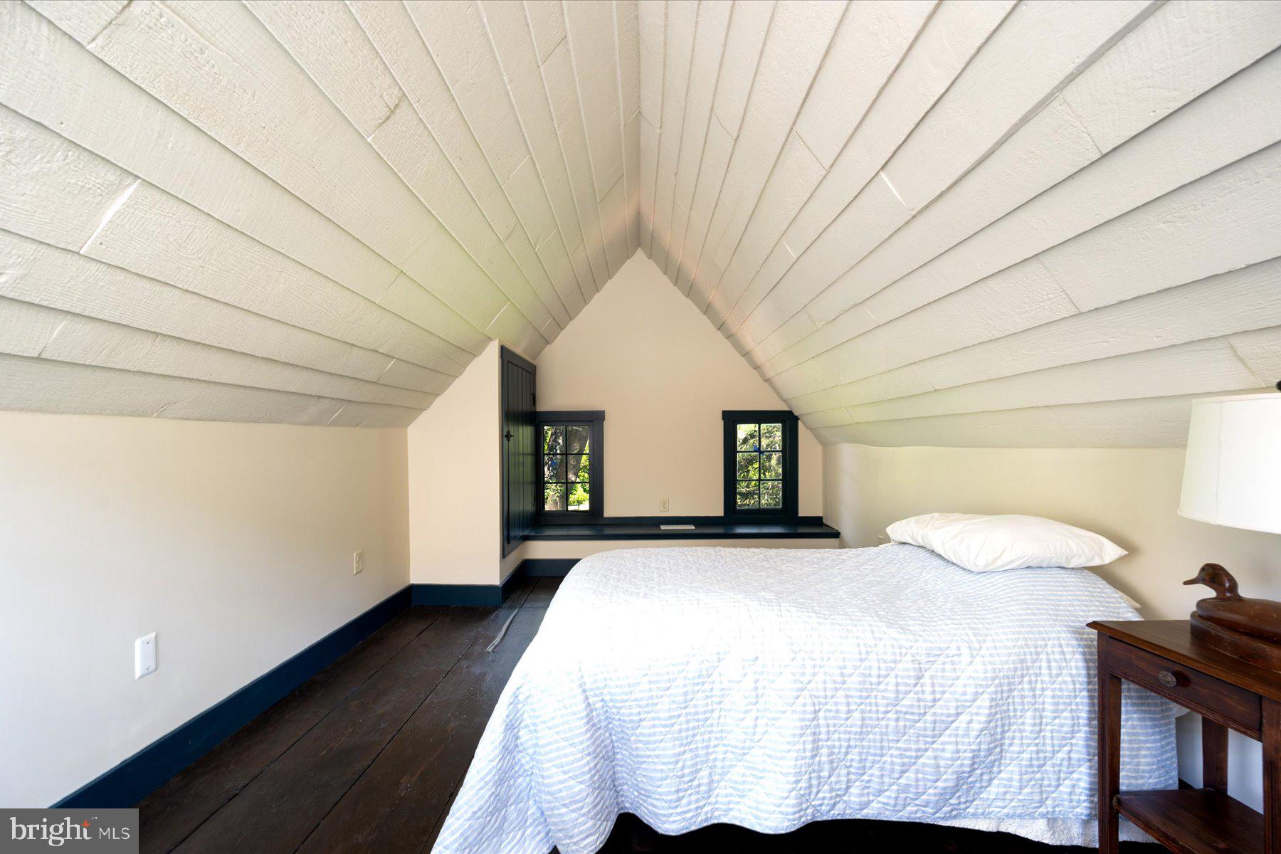 5503 Brooks Woods Road Lothian, MD 20711 - Photo 57 of 99 a bedroom with a bed and a night stand