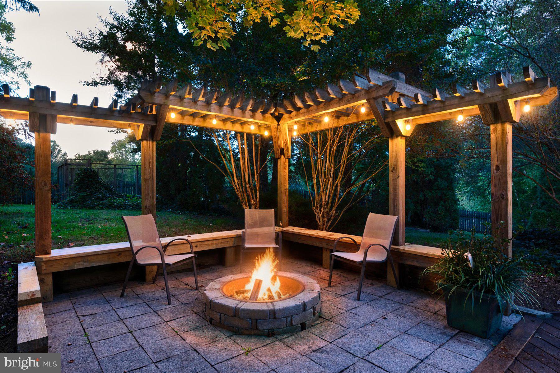 5503 Brooks Woods Road Lothian, MD 20711 - Photo 84 of 99 a view of a patio with a table chairs and a small yard