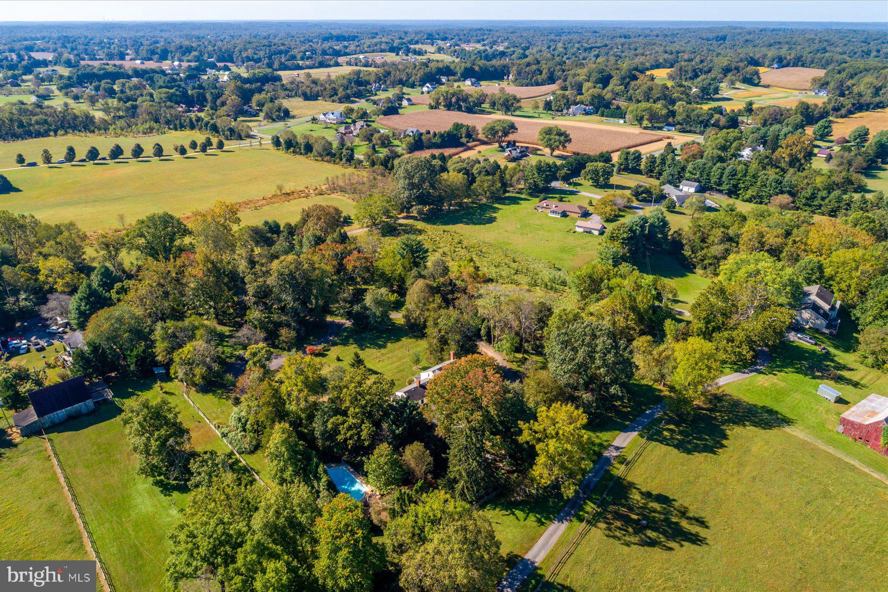 5503 Brooks Woods Road Lothian, MD 20711 - Photo 93 of 99 an aerial view of residential houses with outdoor space and swimming pool