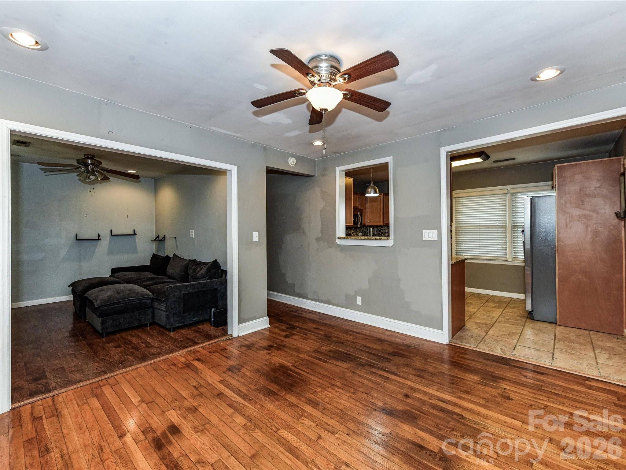 2303 Long Hope Road Monroe, NC 28112 - Photo 11 of 33 a living room with furniture and a ceiling fan