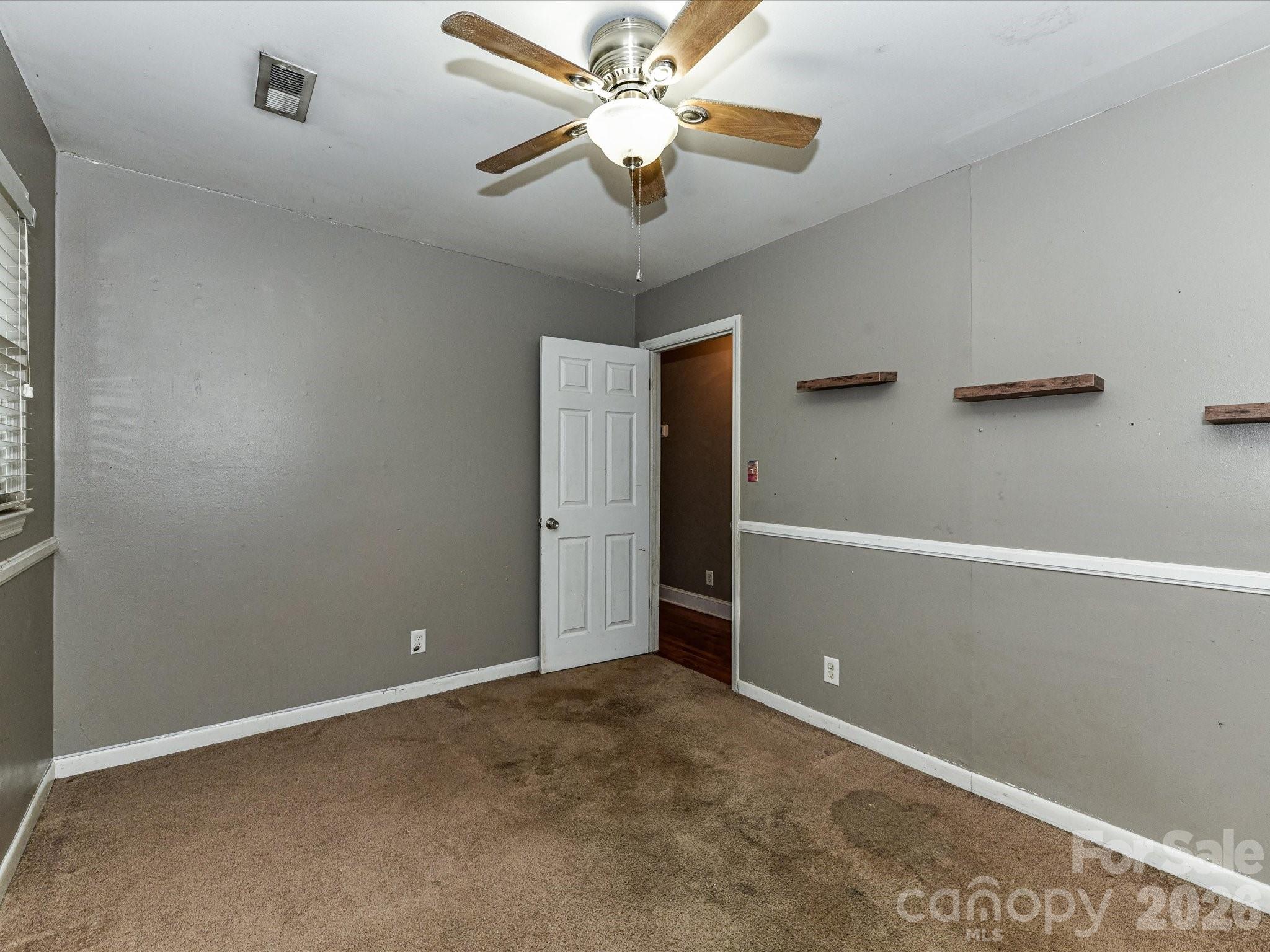 2303 Long Hope Road Monroe, NC 28112 - Photo 14 of 33 a view of an empty room with a window
