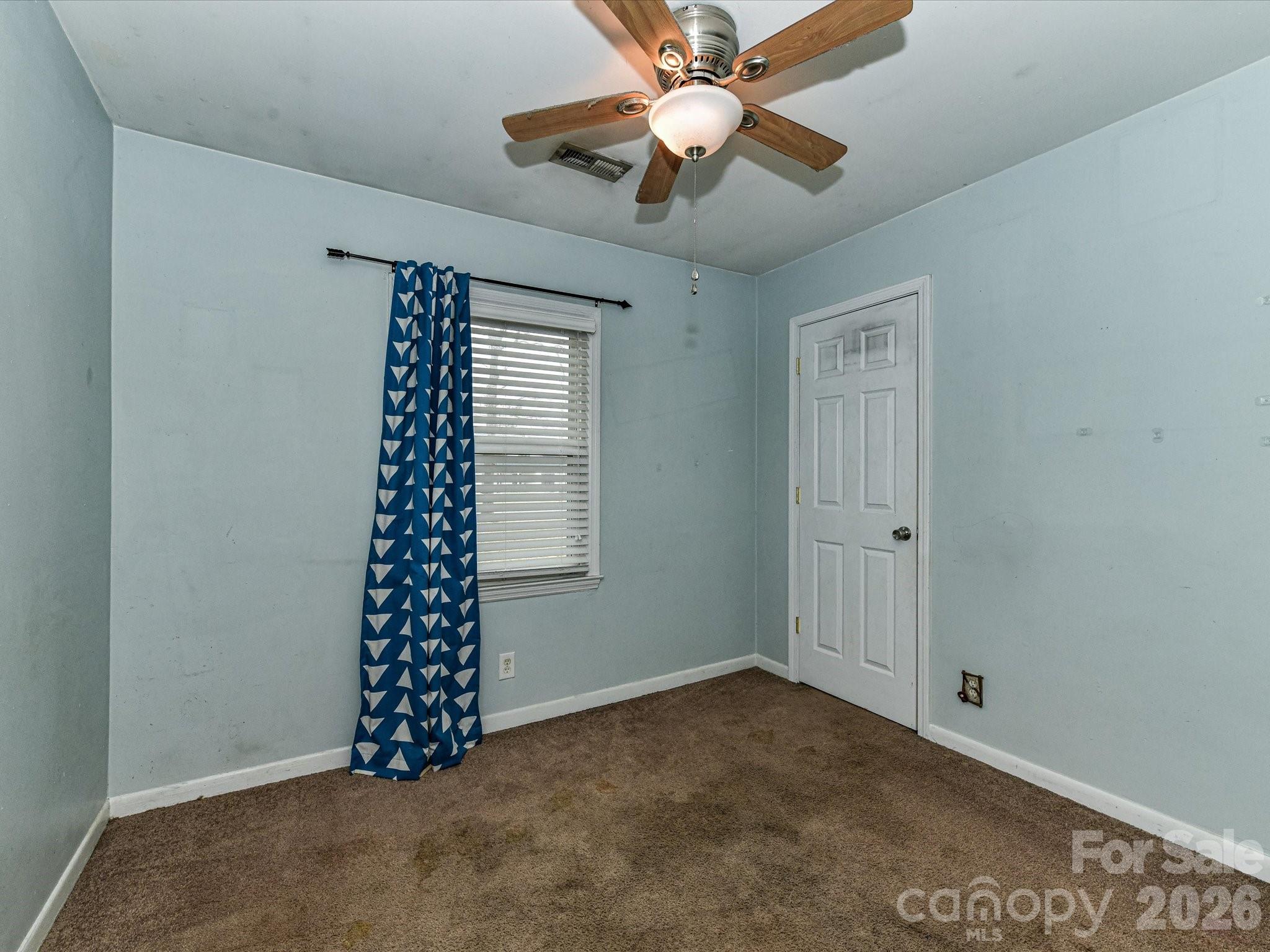 2303 Long Hope Road Monroe, NC 28112 - Photo 20 of 33 a view of an empty room with a window