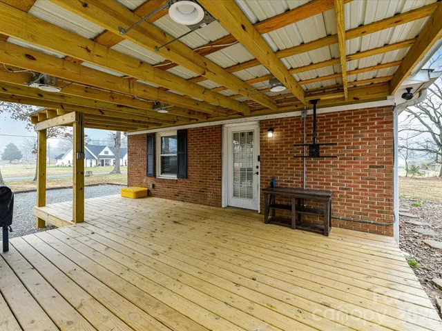 a view of livingroom with wooden floor and door