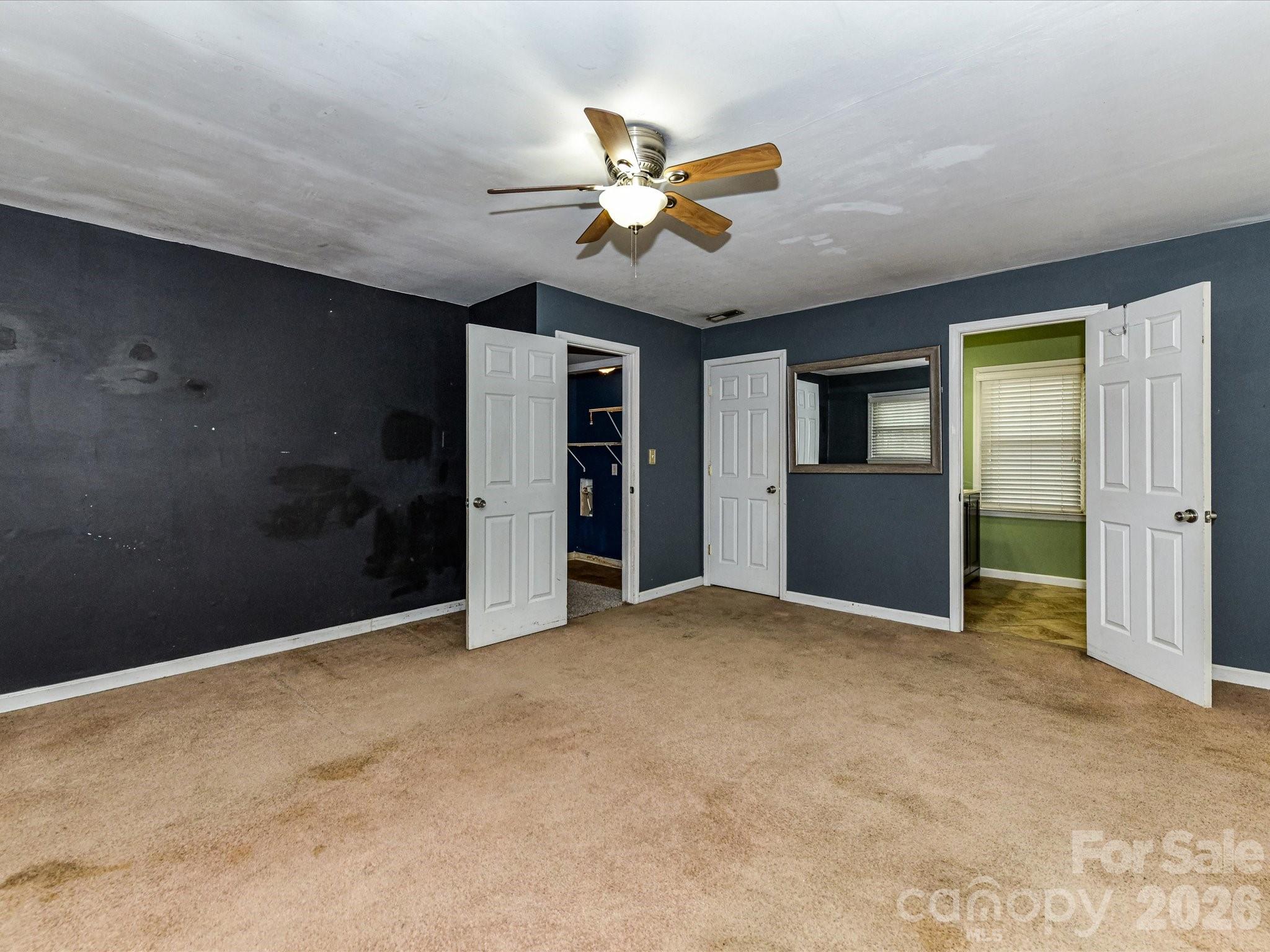 2303 Long Hope Road Monroe, NC 28112 - Photo 24 of 33 a view of an empty room with a ceiling fan