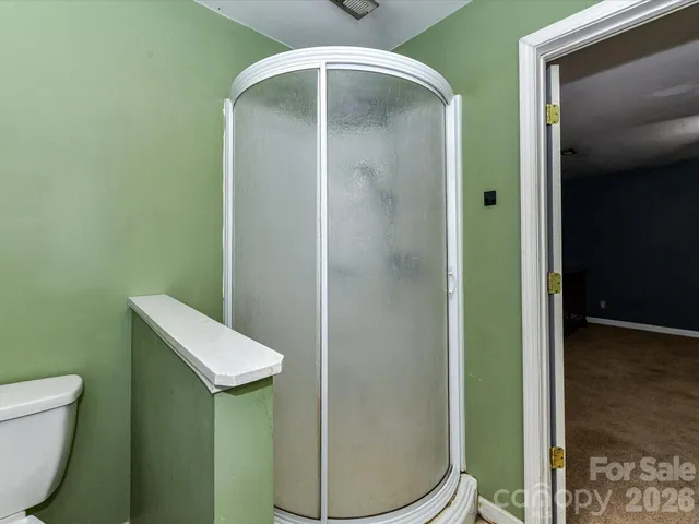 a view of a house with a wooden deck