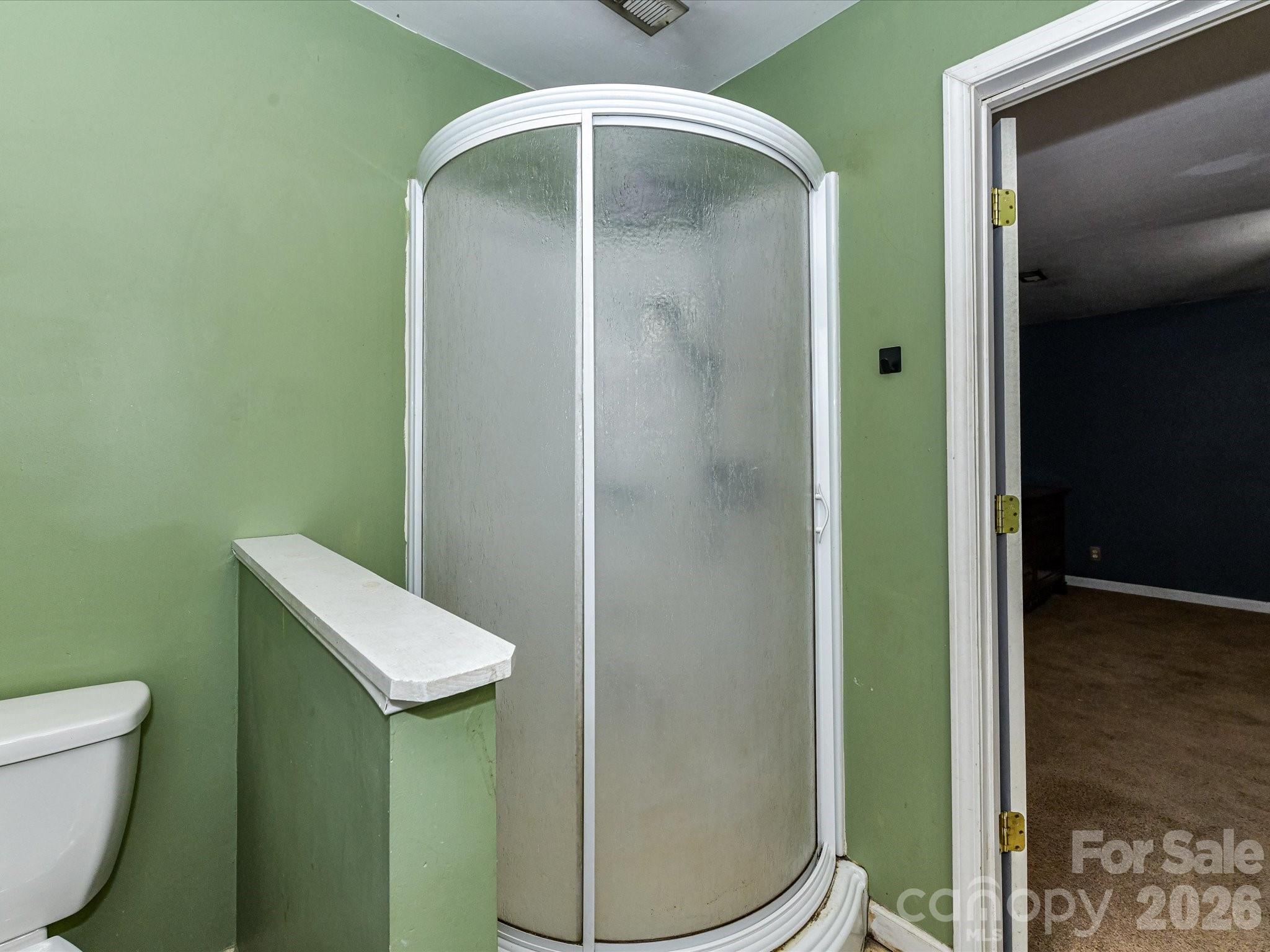 2303 Long Hope Road Monroe, NC 28112 - Photo 27 of 33 a bathroom with a toilet and a sink