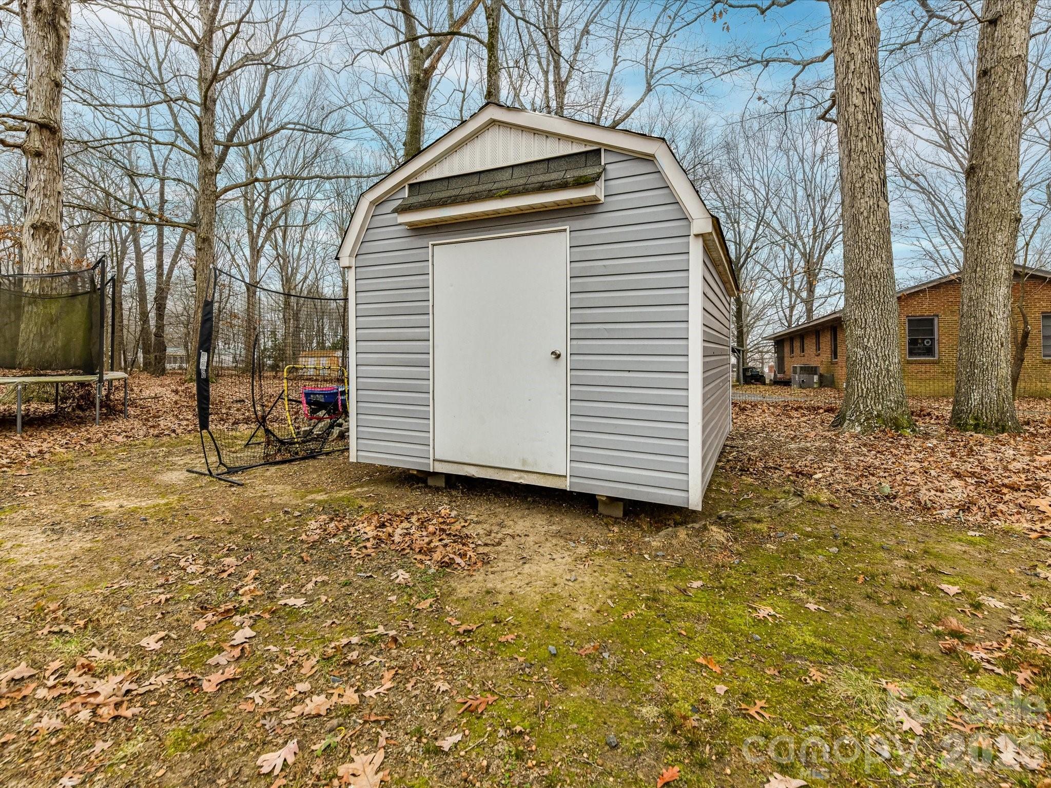 2303 Long Hope Road Monroe, NC 28112 - Photo 30 of 33 a view of a house with a yard