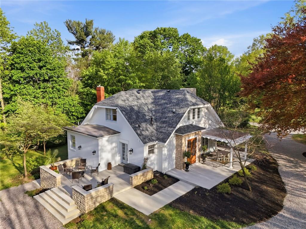 a aerial view of a house with swimming pool and sitting area