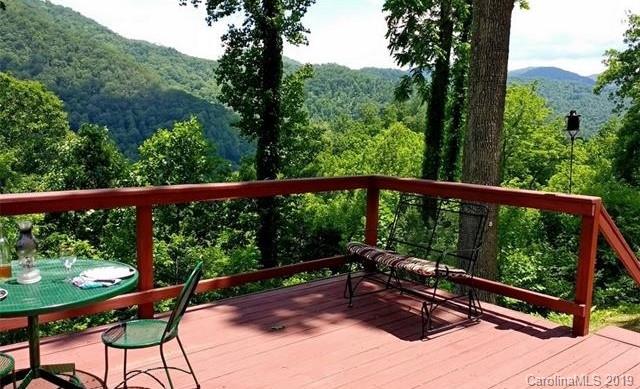 555 Short Ridge Lane Clyde, NC 28721 - Photo 3 of 21 a view of a two chairs in the deck