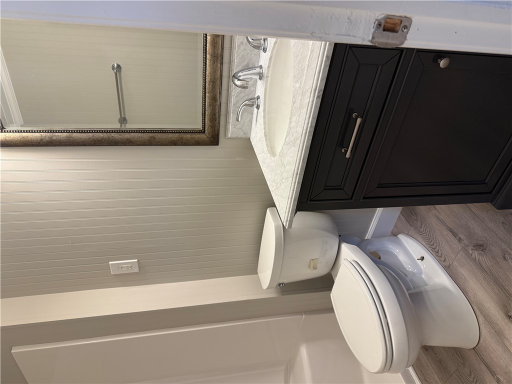 325 Circle Drive Pendleton, SC 29670 - Photo 11 of 21 This bathroom features wainscoting and a dark wood vanity with a white countertop.