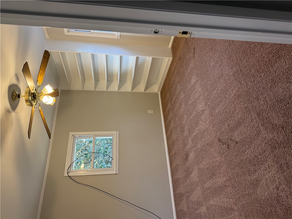 325 Circle Drive Pendleton, SC 29670 - Photo 16 of 21 This inviting room features soft carpeting and a classic ceiling fan, perfect for comfortable living.